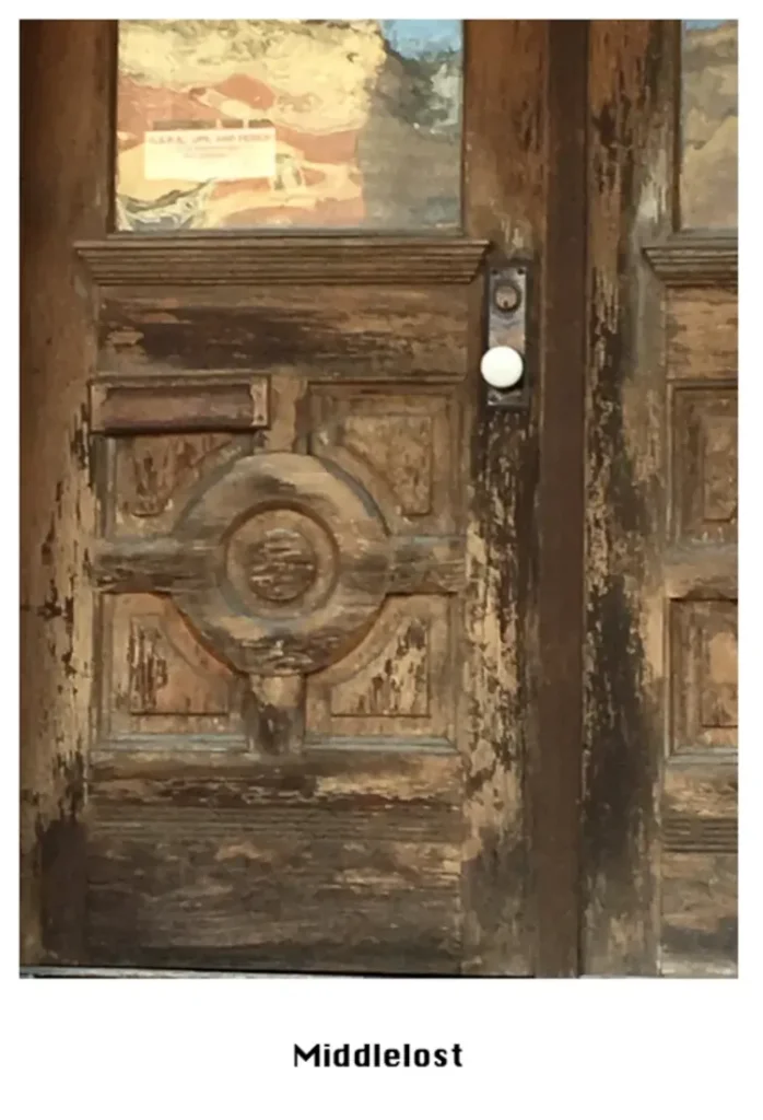 Cover for MiddleLost 1 showing a drawing of an old doorway